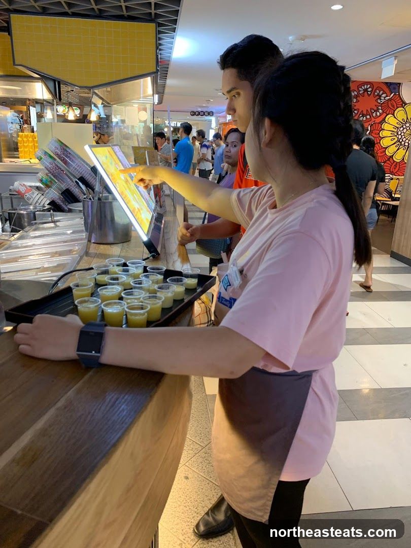 Customers Ordering at a Food Counter