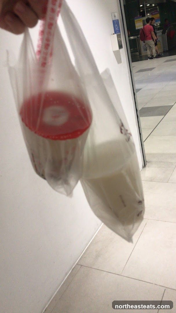 Two drinks in plastic bags
