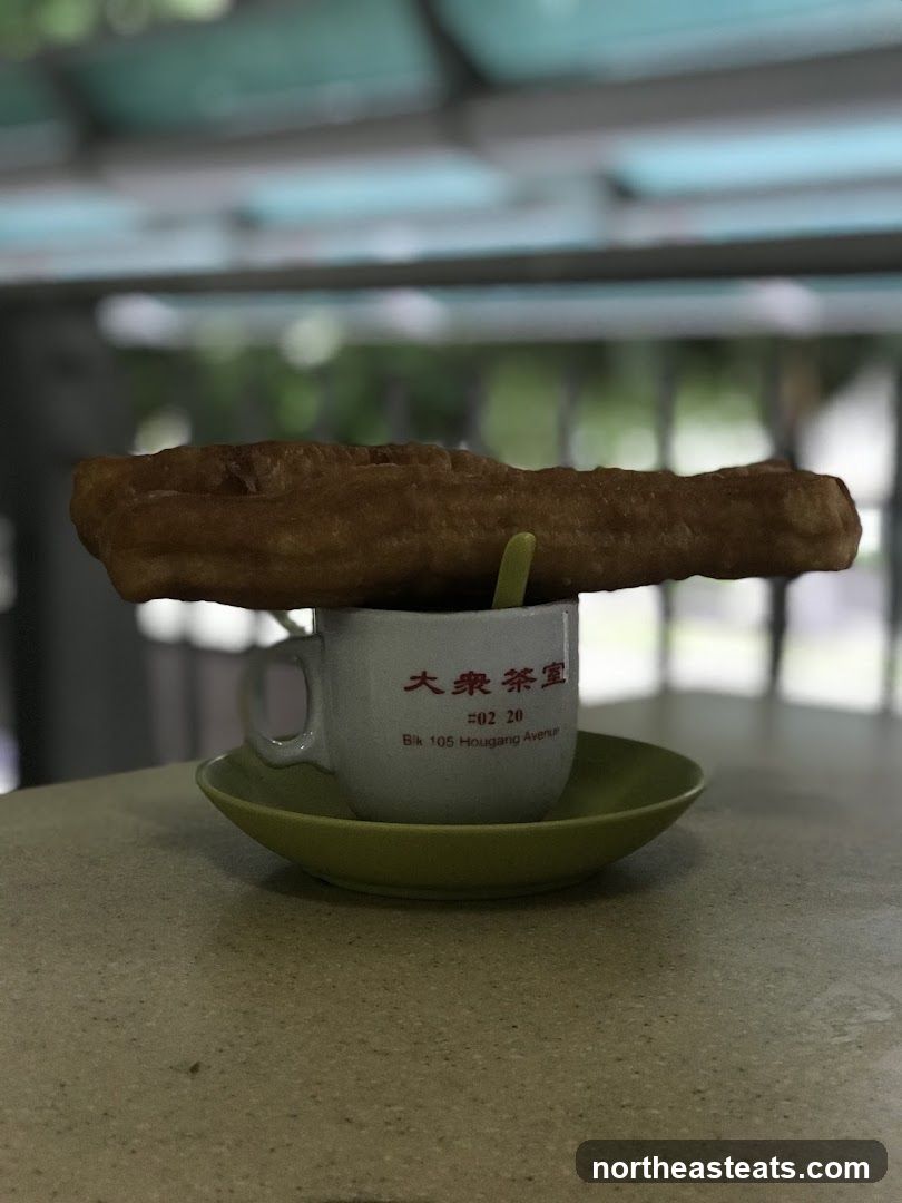 Fried Dough Stick on Coffee Cup