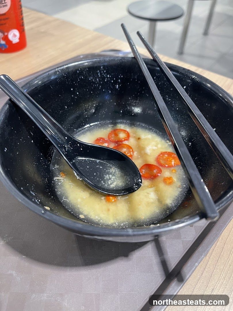 Partially Eaten Bowl of Soup