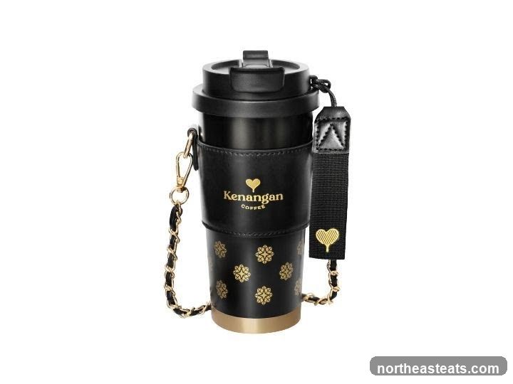 Black coffee cup with gold accents