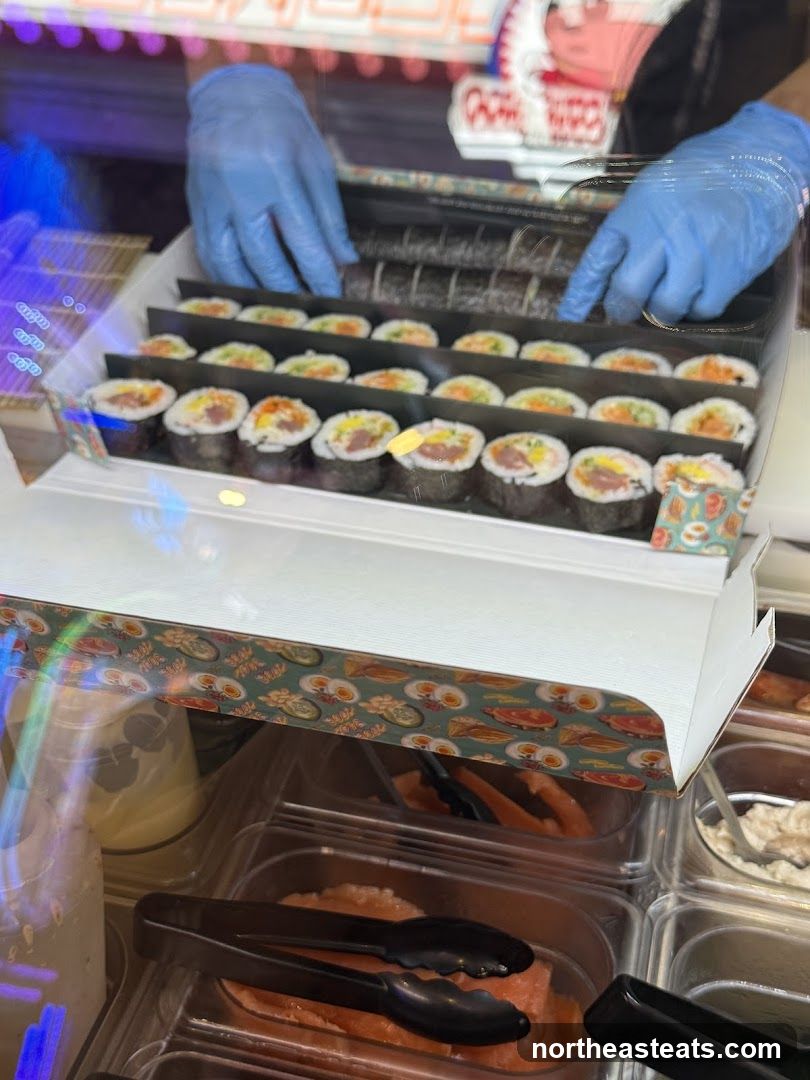 Sushi Rolls Being Prepared