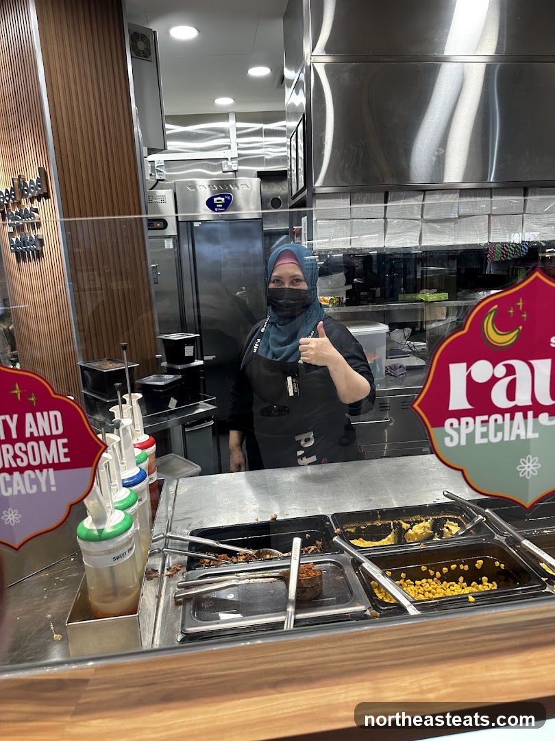 Food Service Worker Giving Thumbs Up
