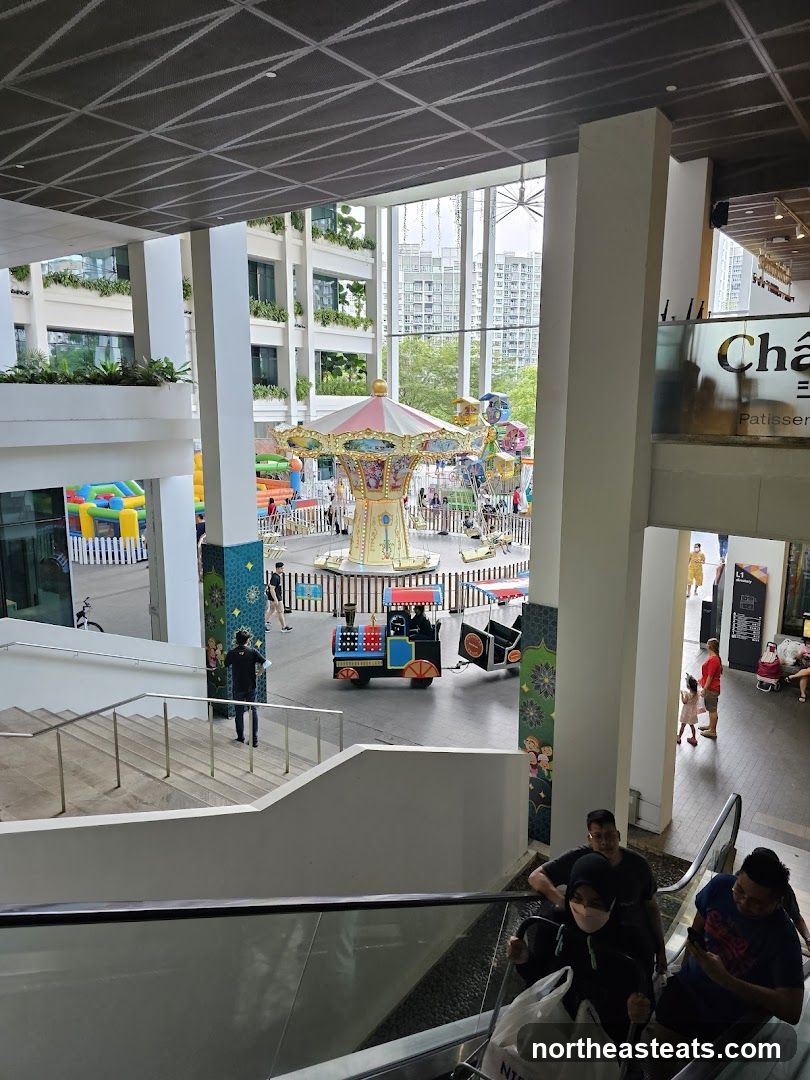 Indoor amusement area with carousel and train