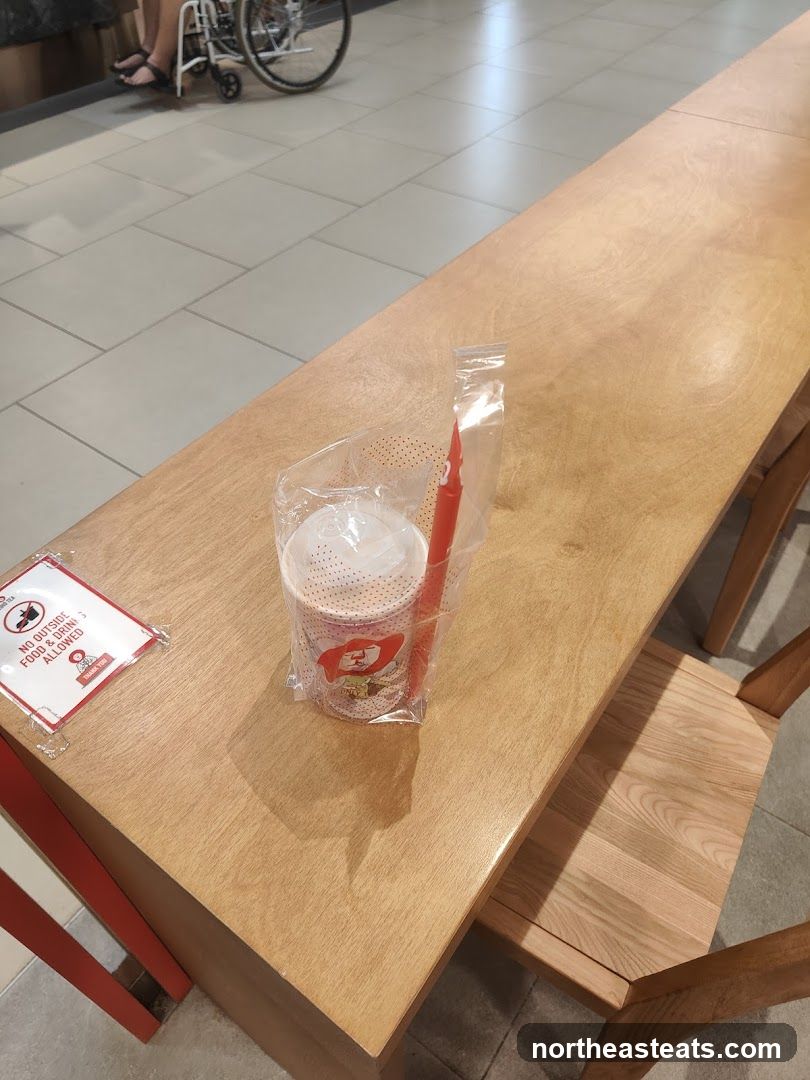 Table with Drink and Sign