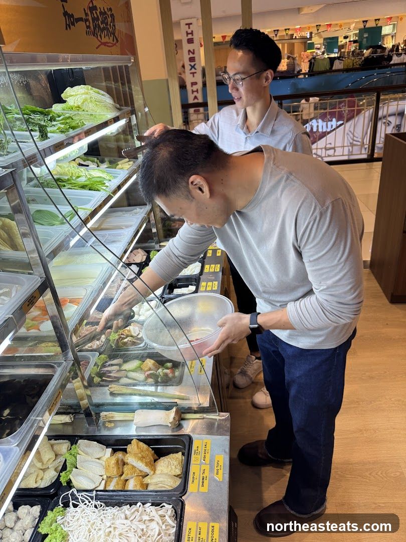 Customers Selecting Ingredients at a Buffet