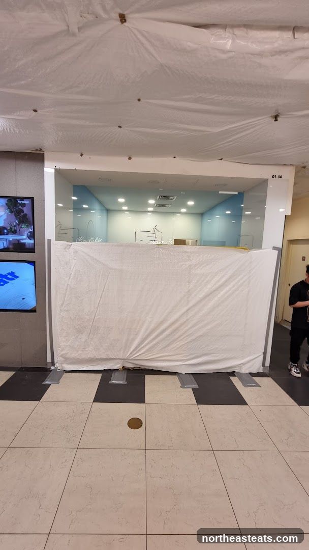 Temporary construction barrier in front of a storefront