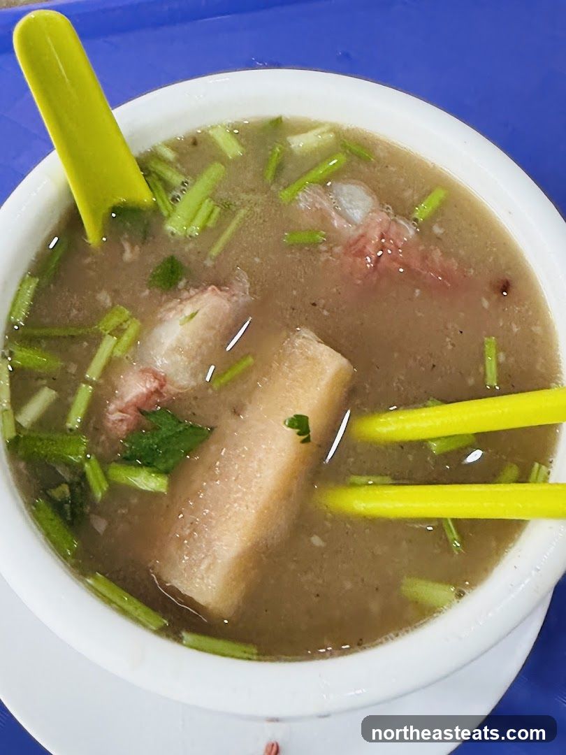 Bowl of Soup with Meat and Vegetables