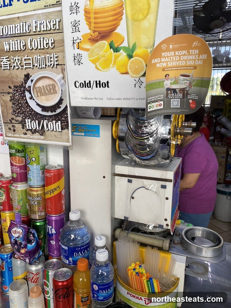 Beverage Stand with Drinks and Signage
