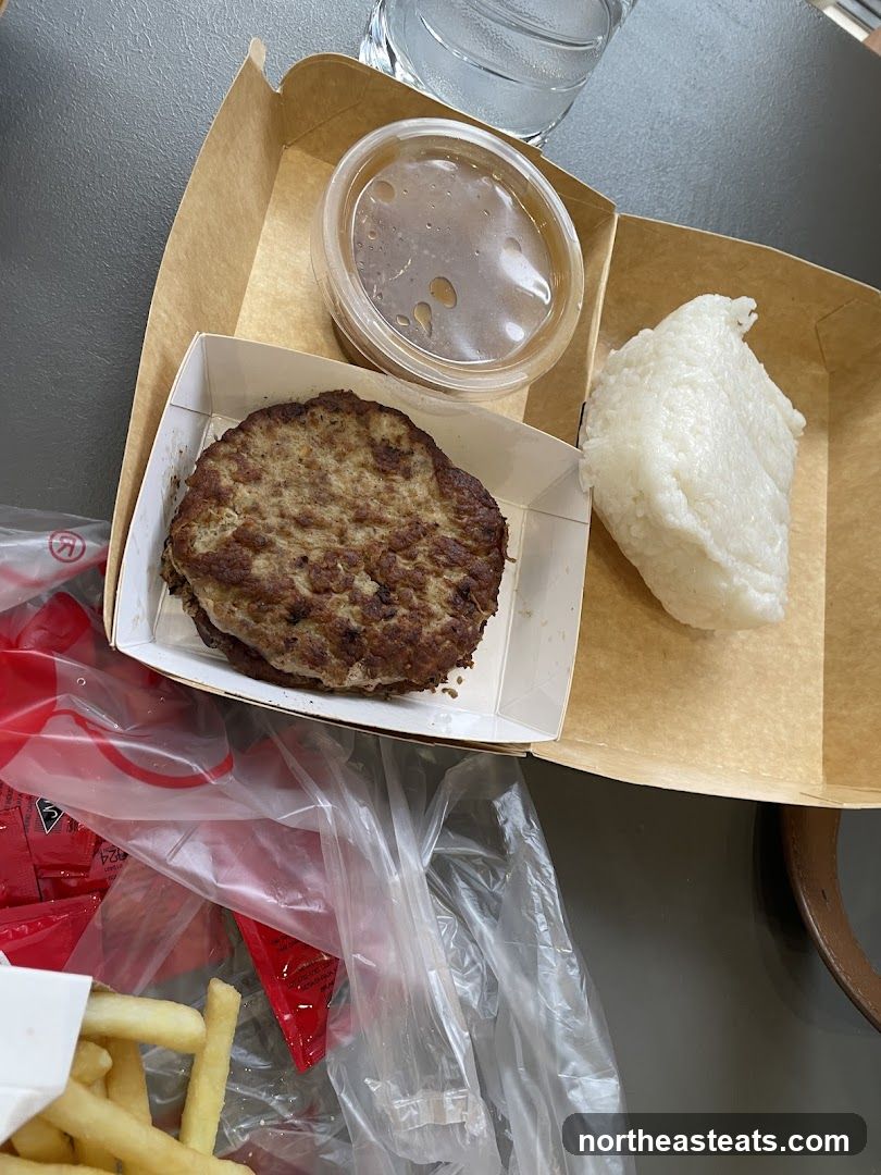 Burger meal with rice and fries