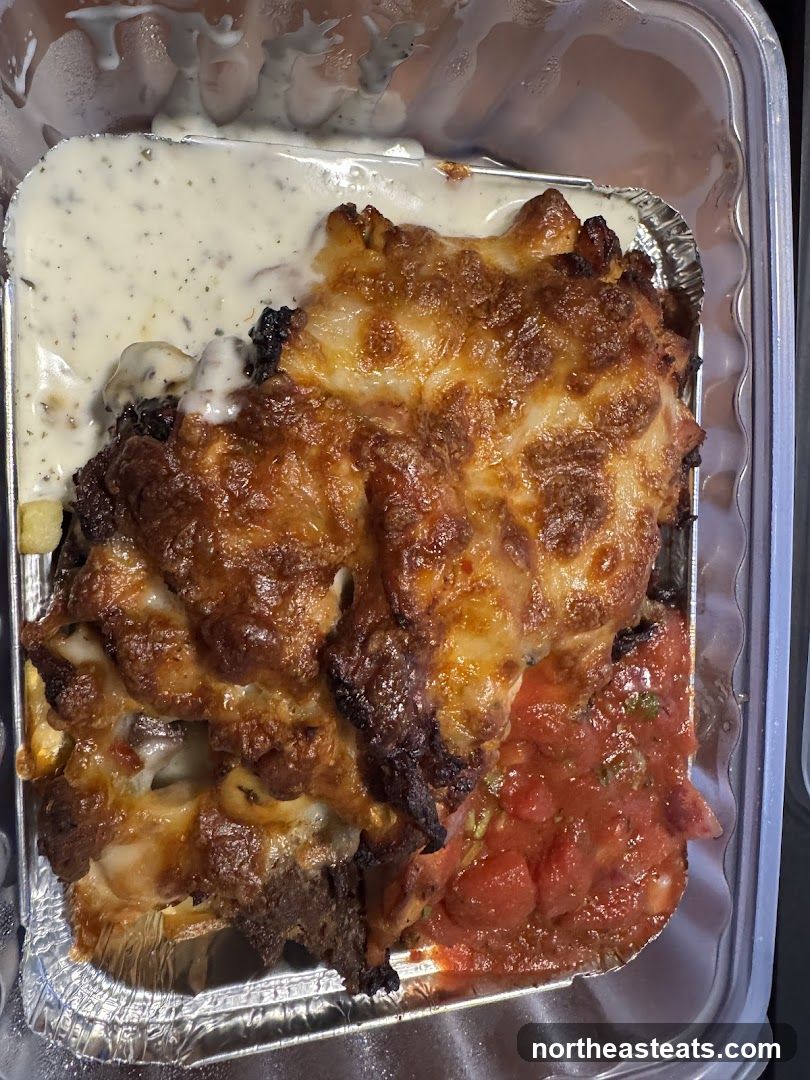 Cheesy Baked Dish with Sauce and Creamy Topping