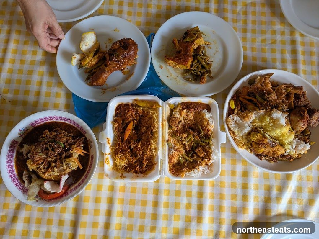 Various dishes served on plates and in takeout containers