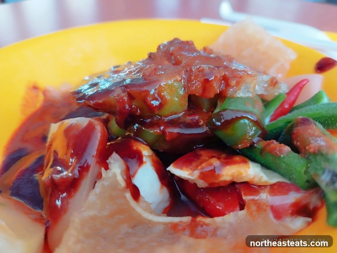 Close-up of a dish with sauce and vegetables