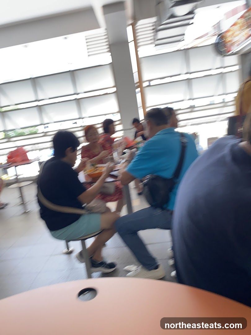 People eating at a food court