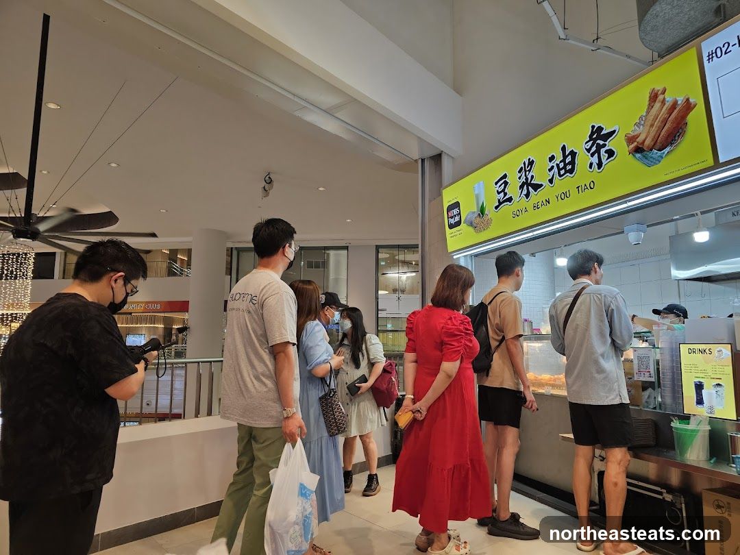 People Queueing at a Food Stall