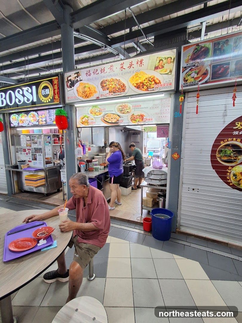 Food Stall with Menu and Seated Customer