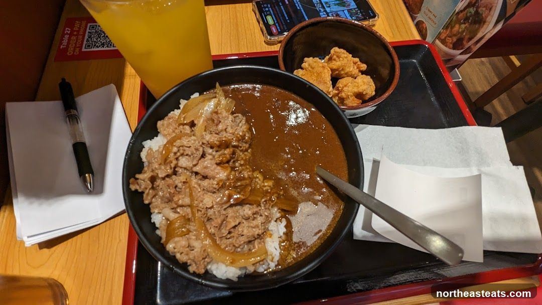 Beef Curry Rice with Fried Chicken and Orange Drink