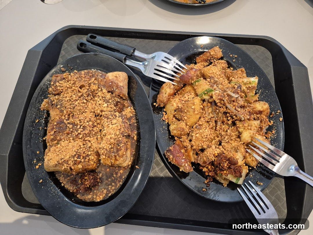 Two plates of food with chopped nuts and sauce