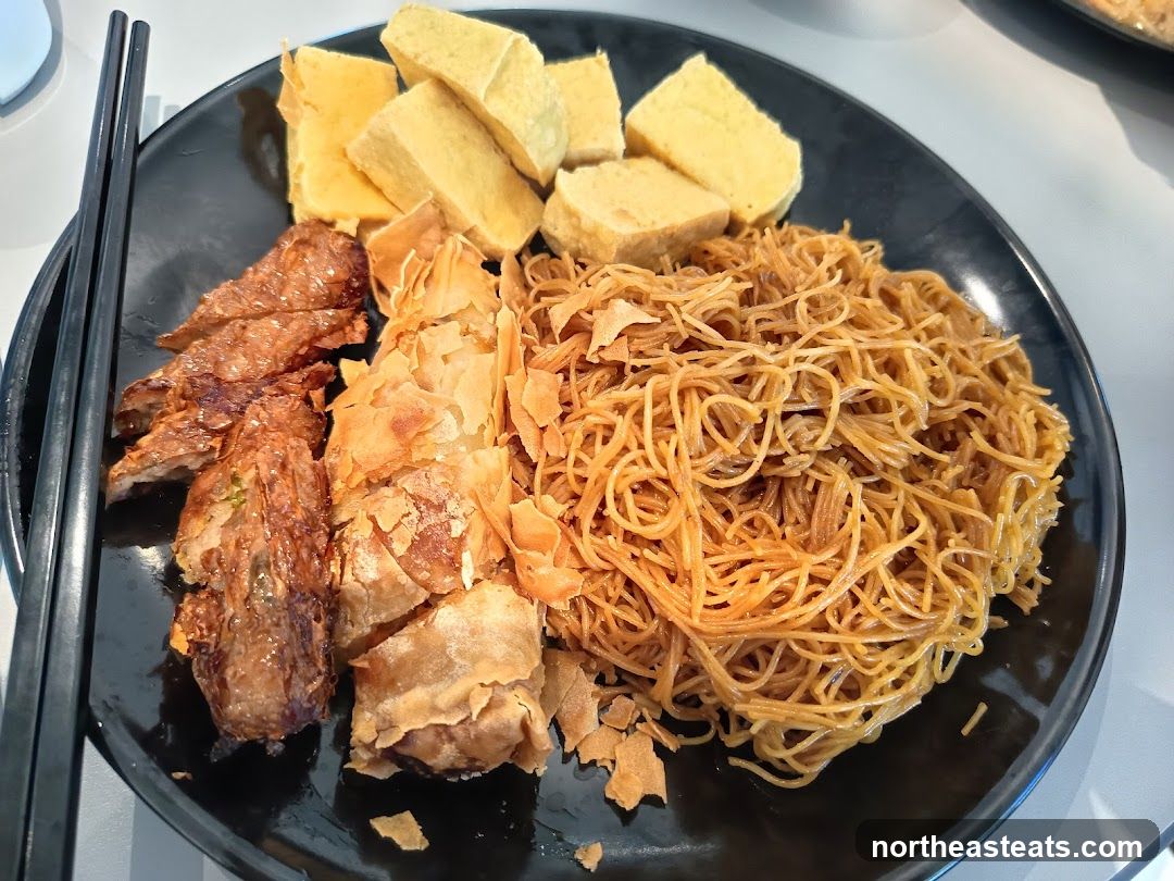 Fried Noodles with Tofu and Meat Rolls