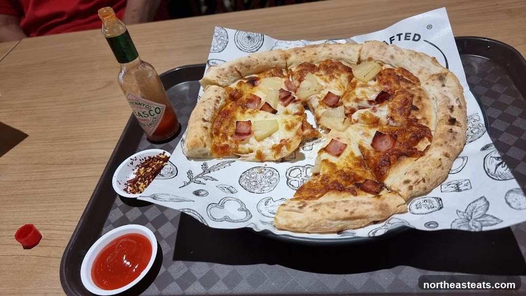 Pizza with toppings and condiments