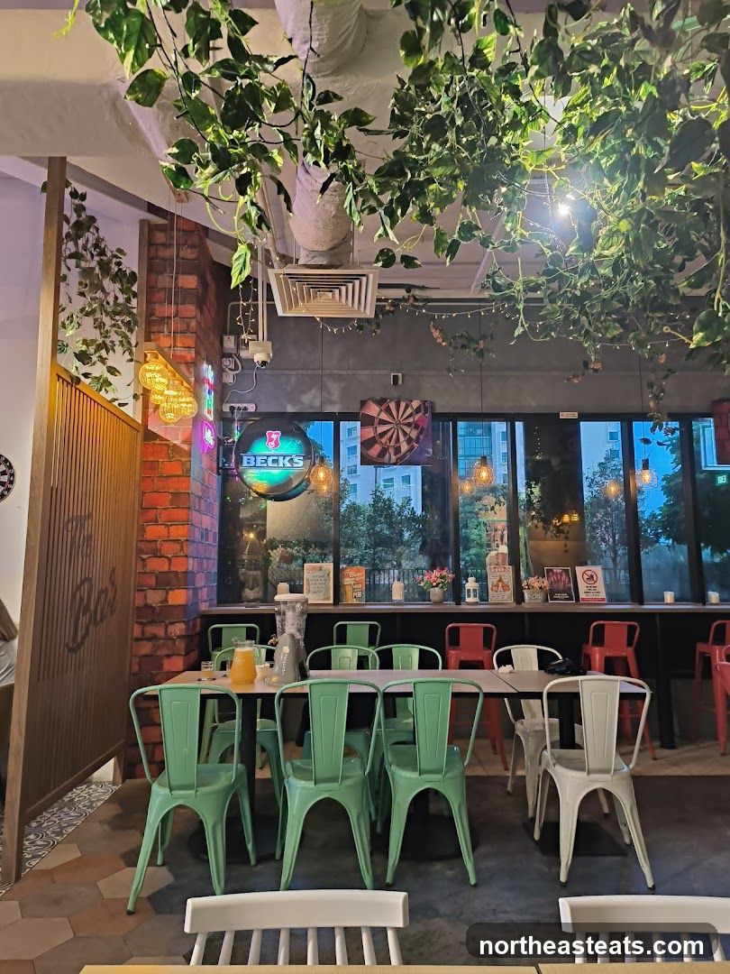 Bar Interior with Green Chairs and Neon Signs
