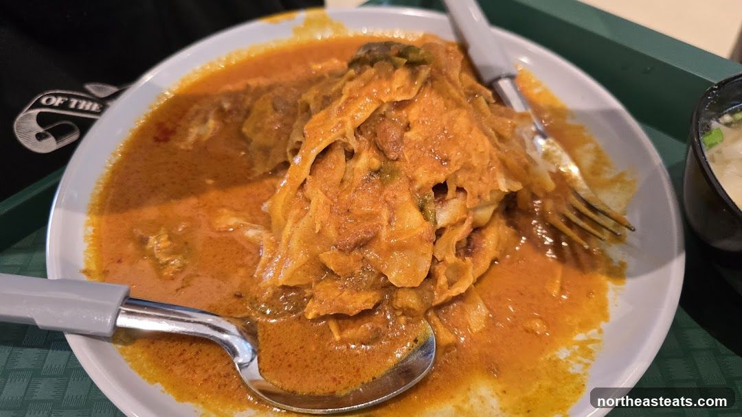 Curry Dish with Spoon and Fork