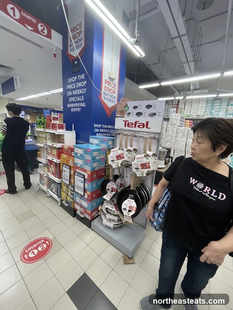 Supermarket aisle with cookware display