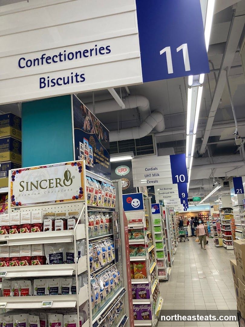 Supermarket aisle with confectionery and biscuit displays