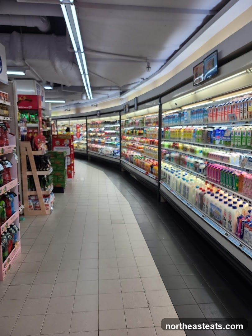 Supermarket aisle with refrigerated displays