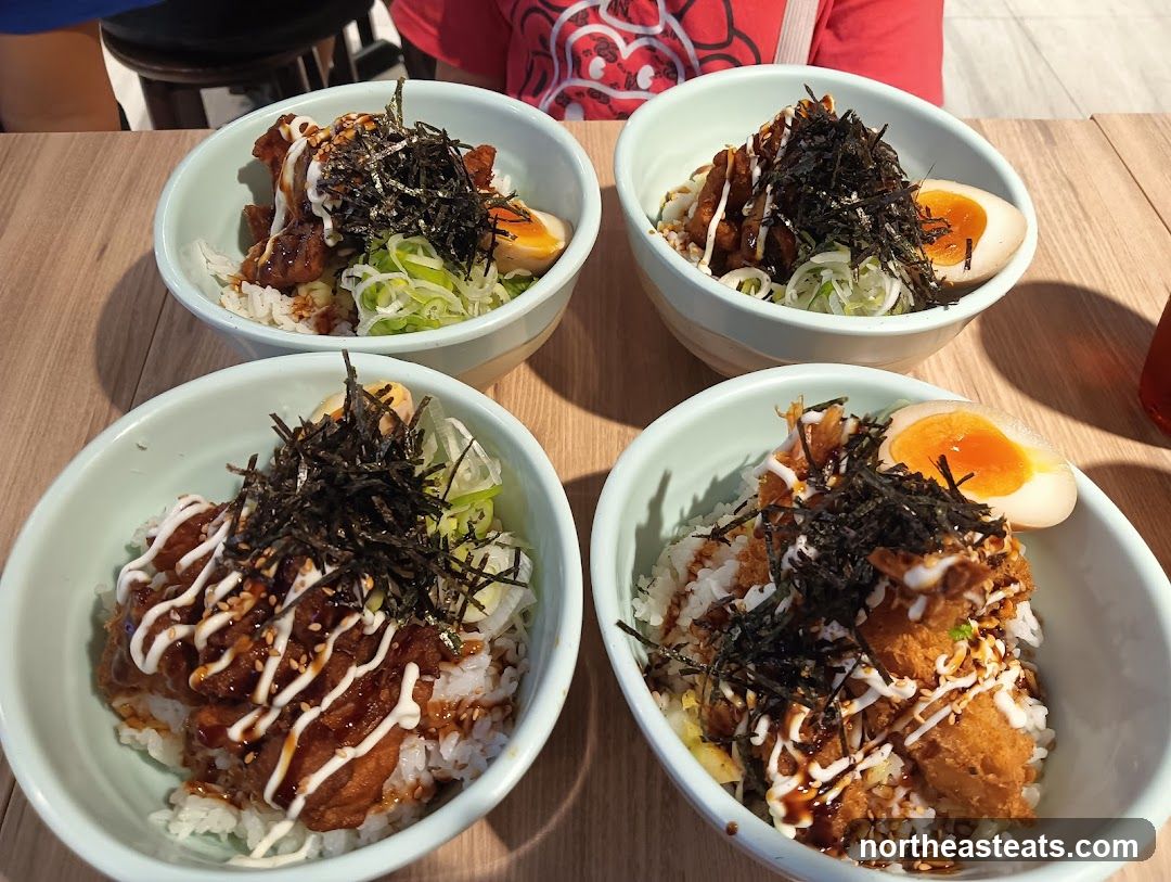 Four Bowls of Rice with Toppings