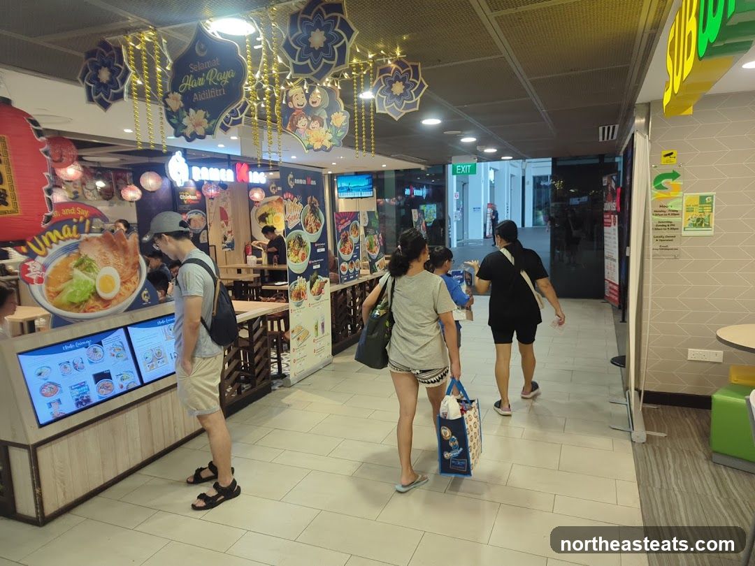 Food court with ramen and subway stalls