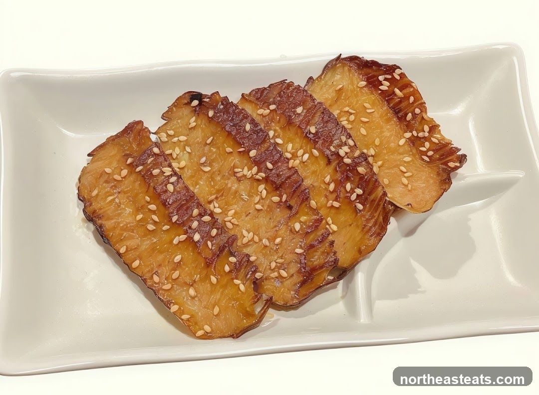 Smoked Fish Slices with Sesame Seeds
