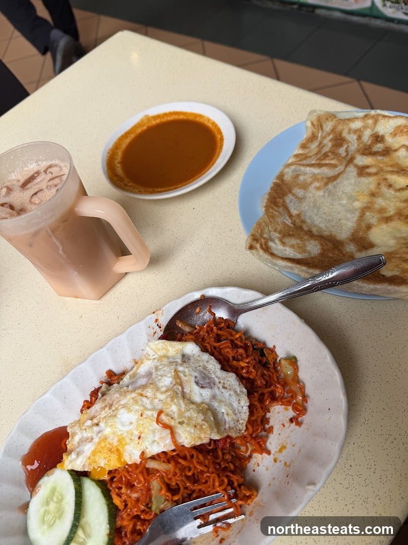 Spicy Noodles with Fried Egg and Roti Canai