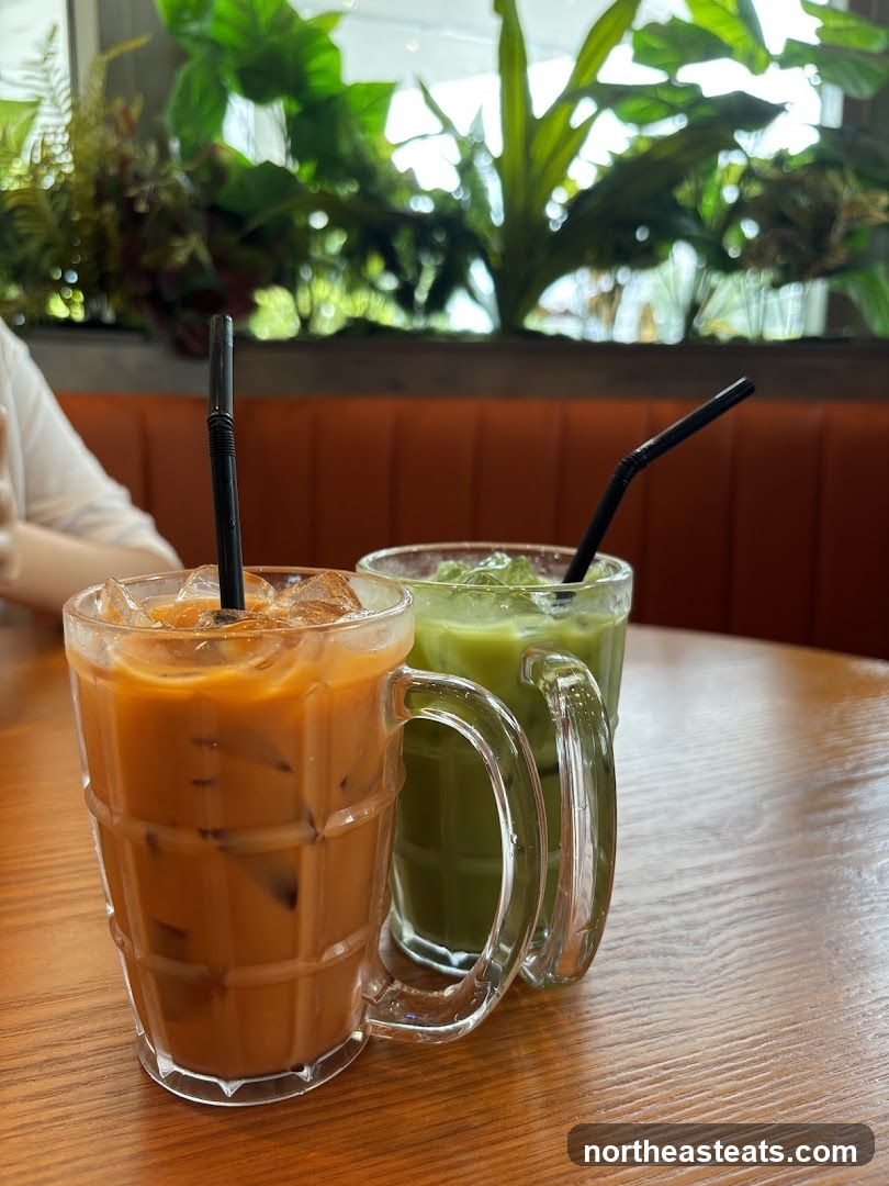 Two iced drinks on a wooden table
