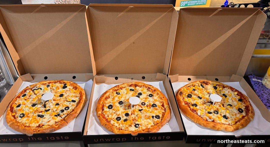 Three Pizzas in Boxes