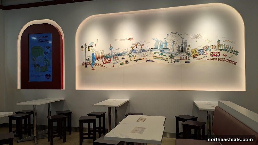 Interior of a cafe with artwork and seating