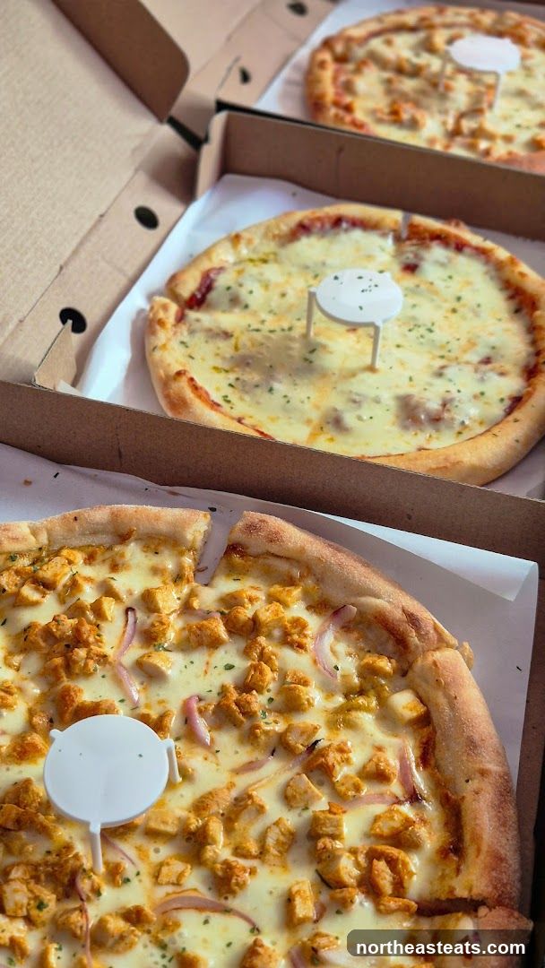 Three Pizzas in Boxes