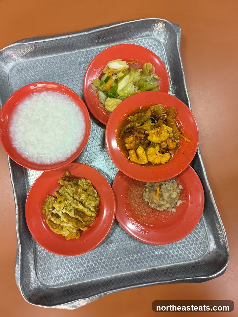 Tray of food with rice porridge and side dishes