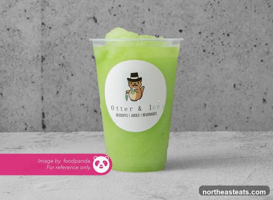 Green slushy with Otter & Ice logo