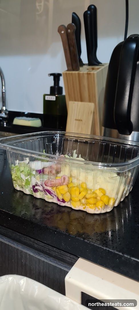 Salad in a plastic container