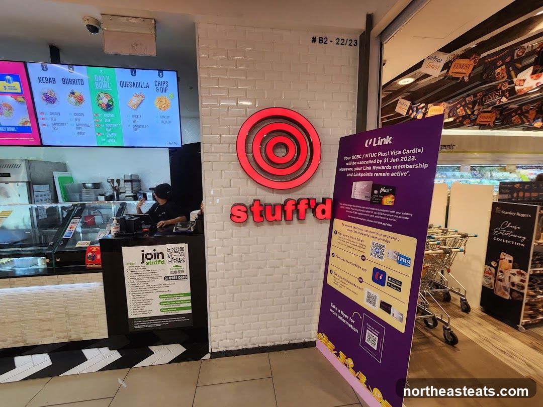 Food stall with menu and promotional displays
