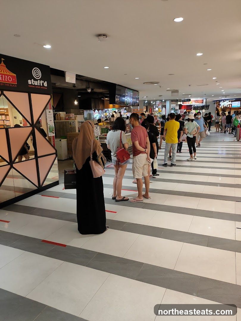 People queuing at a food court