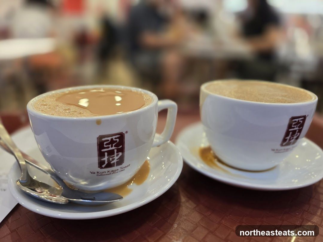 Two cups of coffee with milk