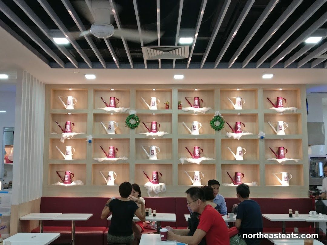 Interior of a cafe with decorative watering cans