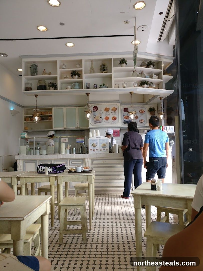 Cafe Interior with Display Shelves and Tables