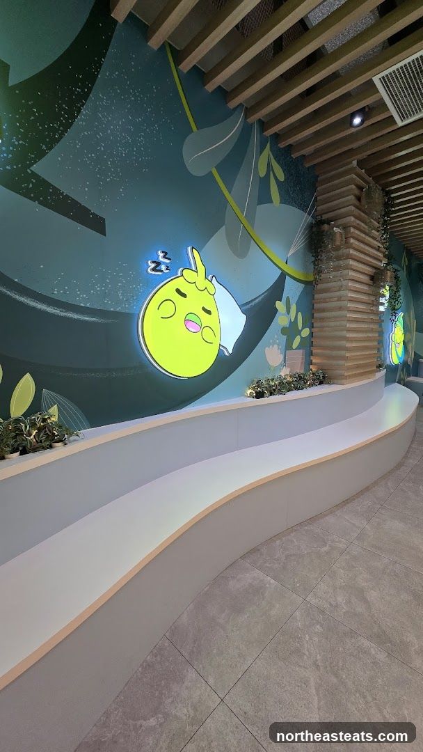 Cartoon character mural with seating area