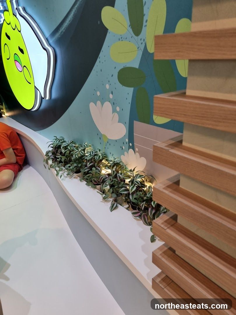 Cartoon character mural with plants and wooden accents