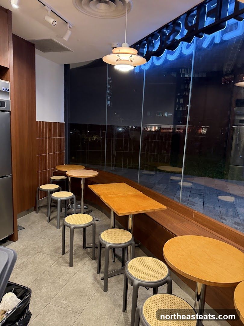 Interior seating area with tables and stools
