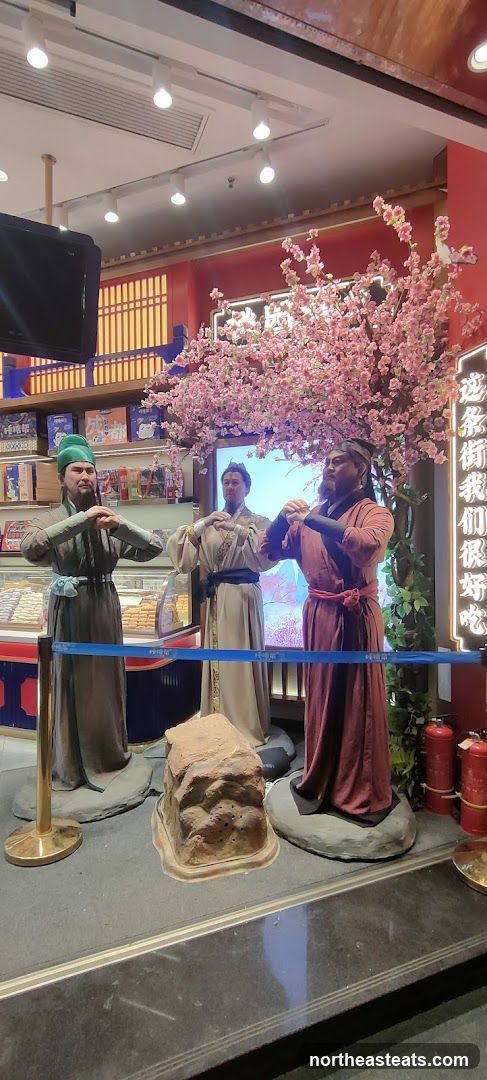 Store Display with Historical Figures and Cherry Blossoms