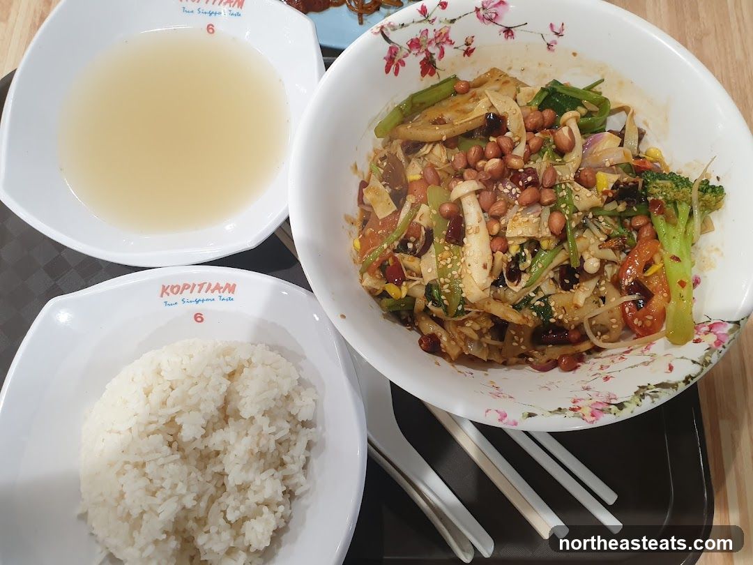 Spicy Noodle Dish with Rice and Soup